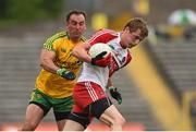 27 June 2015; Brendan Rogers, Derry, is tackled by Karl Lacey, Donegal. Ulster GAA Football Senior Championship, Semi-Final, Derry v Donegal. St Tiernach's Park, Clones, Co. Monaghan. Picture credit: Ramsey Cardy / SPORTSFILE