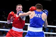 27 June 2015; Michael O'Reilly, Ireland, left, exchanges punches with Xaybula Musalov, Azerbaijan, during their Men's Boxing Middle 75kg Final bout. 2015 European Games, Crystal Hall, Baku, Azerbaijan. Picture credit: Stephen McCarthy / SPORTSFILE