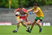27 June 2015; Mark Lynch, Derry, in action against Odhran Mac Niallais, Donegal. Ulster GAA Football Senior Championship, Semi-Final, Derry v Donegal. St Tiernach's Park, Clones, Co. Monaghan. Picture credit: Ramsey Cardy / SPORTSFILE