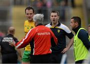 27 June 2015; Derry manager Brian McIver reacts to referee Rory Hickey's decision for giving Derry's Ciaran McFaul a late black card as Donegal's Michael Murphy and manager Rory Gallagher look on. Ulster GAA Football Senior Championship, Semi-Final, Derry v Donegal. St Tiernach's Park, Clones, Co. Monaghan. Picture credit: Oliver McVeigh / SPORTSFILE
