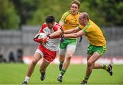 27 June 2015; Christopher McKaigue, Derry, is tackled by Neil Gallagher, Donegal. Ulster GAA Football Senior Championship, Semi-Final, Derry v Donegal. St Tiernach's Park, Clones, Co. Monaghan. Picture credit: Ramsey Cardy / SPORTSFILE