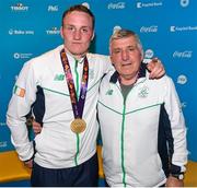 27 June 2015; Michael O'Reilly, Ireland, with Joe Henningan after being presented with his Men's Boxing Middle 75kg gold medal. 2015 European Games, Crystal Hall, Baku, Azerbaijan. Picture credit: Stephen McCarthy / SPORTSFILE