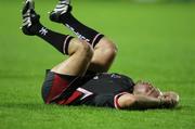 12 September 2008; A dejected Isaac Boss, Ulster, lies on the pitch after the final whistle. Magners League, Cardiff Blues v Ulster, Arms Park, Cardiff, Wales. Picture credit: Steve Pope / SPORTSFILE