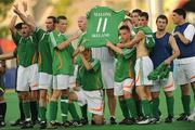 12 September 2008; The jersey of Ireland player Derek Malone who was ruled ineligible to play in the 7-A-Side soccer competition by CP-ISRA (Cerebral Palsy International Sports and Recreation Association, is held aloft after the match by team-mates, from left, Finbarr O'Riordan, from Mitchelstown, Cork, Dublin, Alan O'Hara, Portrane, Dublin, Paul Dollard, Rathfarnham, Dublin, Aidan Brennan, Lucan, Dublin, Mark Jones, Belfast, Antrim, Joe Markey, Clontibret, Monaghan, Gary Messett, Bray, Wicklow, Kieran Devlin, Inchicore, and Darren Kavanagh, Greenhills, Dublin. The match ended in a 1-1 draw and means Ireland will face China in a classification match this coming Sunday 14th. Beijing Paralympic Games 2008, Ireland v Great Britain, 7-A-Side Soccer, First Round, Group B, Match 12, Olympic Green Hockey Field A, Beijing, China. Picture credit: Brian Lawless / SPORTSFILE