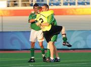 12 September 2008; Ireland Paralympian Derek Malone, right, from Whitegate, Clare, who was ruled ineligible to play in the 7-A-Side soccer competition by CP-ISRA (Cerebral Palsy International Sports and Recreation Association, celebrates with team-mates Brian McGillivary, from Firhouse, Dublin, and Finbarr O'Riordan, from Mitchelstown, Cork, after the match. The match ended in a 1-1 draw and means Ireland will face China in a classification match this coming Sunday 14th. Beijing Paralympic Games 2008, Ireland v Great Britain, 7-A-Side Soccer, First Round, Group B, Match 12, Olympic Green Hockey Field A, Beijing, China. Picture credit: Brian Lawless / SPORTSFILE