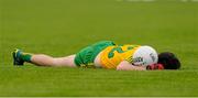 27 June 2015; Ryan McHugh, Donegal, lies injured on the ground after a late challenge. Ulster GAA Football Senior Championship, Semi-Final, Derry v Donegal. St Tiernach's Park, Clones, Co. Monaghan. Picture credit: Oliver McVeigh / SPORTSFILE