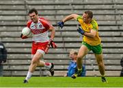 27 June 2015; Mark Lynch, Derry, in action against Neil McGee, Donegal. Ulster GAA Football Senior Championship, Semi-Final, Derry v Donegal. St Tiernach's Park, Clones, Co. Monaghan. Picture credit: Oliver McVeigh / SPORTSFILE