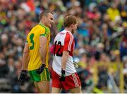 27 June 2015; Neil Gallagher, Donegal, talks to Enda Lynn, Derry, off the ball. Ulster GAA Football Senior Championship, Semi-Final, Derry v Donegal. St Tiernach's Park, Clones, Co. Monaghan. Picture credit: Oliver McVeigh / SPORTSFILE
