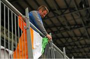 28 June 2015; Republic of Ireland supporter Darren Doyle hangs an Irish flag out before the game. UEFA European Women's Under-17 Championship Finals, Republic of Ireland v Norway. Korinn, Kopavogur, Iceland. Picture credit: Eoin Noonan / SPORTSFILE