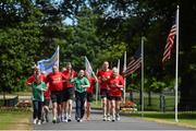 28 June 2015; Team Ireland athletes received a major boost to their preparations for the 2015 Special Olympics World Summer Games due to be held in Los Angeles next month, with a special reception hosted by the U.S. Ambassador to Ireland. The event took place today at the official residence of U.S. Ambassador to Ireland, Kevin F. O’Malley, in the Phoenix Park, Dublin, and included a symbolic Law Enforcement Torch Run, featuring members of the Garda Siochana and Police Service of Northern Ireland. Pictured is the Law Enforcement Torch Run with Special Olympic athletes carrying the torch, Amy Duffy, Basketball, Swords Basketball Special Olympics Club and Francis Power, Table Tennis, Navan Arch Club. US Ambassador's Residence, Phoenix Park, Dublin. Picture credit: Ramsey Cardy / SPORTSFILE