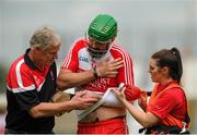 28 June 2015; Ruairi Convery, Derry, is helped off the field after being injured. Ulster GAA Hurling Senior Championship, Semi-Final, Derry v Down. Owenbeg, Derry. Picture credit: Seb Daly / SPORTSFILE