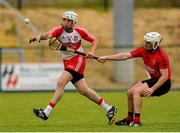 28 June 2015; Sean McCullagh, Derry, in action against Declan McManus, Down. Ulster GAA Hurling Senior Championship, Semi-Final, Derry v Down. Owenbeg, Derry. Picture credit: Seb Daly / SPORTSFILE