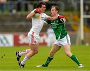 28 June 2015; Aidan McCrory, Tyrone, in action against Sean Buckley, Limerick. GAA Football All-Ireland Senior Championship, Round 1B, Tyrone v Limerick. Healy Park, Omagh, Co. Tyrone. Picture credit: Oliver McVeigh / SPORTSFILE