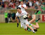 28 June 2015; Cathal McCarron, Tyrone, in action against Cian Sheehan, Limerick. GAA Football All-Ireland Senior Championship, Round 1B, Tyrone v Limerick. Healy Park, Omagh, Co. Tyrone. Picture credit: Oliver McVeigh / SPORTSFILE