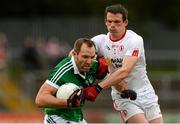 28 June 2015; Tom Lee, Limerick, in action against Aidan McCrory, Tyrone. GAA Football All-Ireland Senior Championship, Round 1B, Tyrone v Limerick. Healy Park, Omagh, Co. Tyrone. Picture credit: Oliver McVeigh / SPORTSFILE