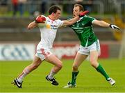 28 June 2015; Aidan McCrory, Tyrone, in action against Sean Buckley, Limerick. GAA Football All-Ireland Senior Championship, Round 1B, Tyrone v Limerick. Healy Park, Omagh, Co. Tyrone. Picture credit: Oliver McVeigh / SPORTSFILE