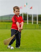 28 June 2015; Young Tomás Conway, from Kilclief, plays on the pitch after watching his father, Fintan Conway, play for Down earlier. Ulster GAA Hurling Senior Championship, Semi-Final, Derry v Down. Owenbeg, Derry. Picture credit: Seb Daly / SPORTSFILE