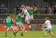 28 June 2015; Justin McMahon, Tyrone, in action against Geroid Hegarty and Tom Lee, Limerick. GAA Football All-Ireland Senior Championship, Round 1B, Tyrone v Limerick. Healy Park, Omagh, Co. Tyrone. Picture credit: Oliver McVeigh / SPORTSFILE