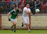 28 June 2015; Cathal McCarron, Tyrone, in action against Danny Neville, Limerick. GAA Football All-Ireland Senior Championship, Round 1B, Tyrone v Limerick. Healy Park, Omagh, Co. Tyrone. Picture credit: Oliver McVeigh / SPORTSFILE