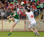 28 June 2015; Gearoid Hegarty, Limerick, in action against Cathal McCarron, Tyrone. GAA Football All-Ireland Senior Championship, Round 1B, Tyrone v Limerick. Healy Park, Omagh, Co. Tyrone. Picture credit: Oliver McVeigh / SPORTSFILE