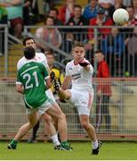 28 June 2015; Mark Bradley, Tyrone, in action against Cian Sheehan, Limerick. GAA Football All-Ireland Senior Championship, Round 1B, Tyrone v Limerick. Healy Park, Omagh, Co. Tyrone. Picture credit: Oliver McVeigh / SPORTSFILE