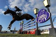 26 June 2015; Cian O'Connor of Co. Meath competing on Quidam's Cherie in The Underwriting Exchange Limited &quot;Jumping In The City&quot; Grand Prix during the Final Leg of Jumping In The City. Shelbourne Park Greyhound Stadium, Ringsend, Dublin. Picture credit: Cody Glenn / SPORTSFILE
