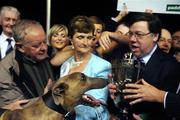 13 September 2008; Shelbourne Aston, winner of the Paddy Power Irish Greyhound Derby, looks on as An Taoiseach Brian Cowen, T.D presents the winning trophy. Paddy Power Irish Greyhound Derby, Shelbourne Park, Ringsend, Dublin. Picture credit; Damien Eagers / SPORTSFILE