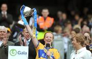 14 September 2008; Clare captain Deidre Murphy lifts the New Ireland Cup, as President of the Camogie Association Liz Howard  and Gary Desmond, CEO of Gala, left, watch on. Gala All-Ireland Junior Camogie Championship Final, Clare v Offaly, Croke Park, Dublin. Picture credit: Stephen McCarthy / SPORTSFILE