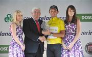 31 August 2008; Marco Pinotti, Team Columbia, is presented with his trophy by Minister for Education and Science Batt O'Keefe, T.D. after winning the Tour of Ireland. 2008 Tour of Ireland - Stage 5, Killarney - Cork. Picture credit: Stephen McCarthy / SPORTSFILE