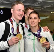 29 June 2015; Team Ireland gold medallists Michael O'Reilly, Men's Boxing Middle 75kg gold and Katie Taylor, Women's Boxing Light 60kg gold, are greeted by fans on their return from the 2015 Baku European Games. Terminal One, Dublin Airport.  Picture credit: Cody Glenn / SPORTSFILE