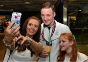 29 June 2015; Michael O'Reilly, Men's Boxing Middle 75kg gold, Team Ireland, poses for a picture with fans Noala Muldoon and Caitlin Muldoon, 8, of Belfast, on his return from the 2015 Baku European Games. Terminal One, Dublin Airport.  Picture credit: Cody Glenn / SPORTSFILE