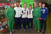 29 June 2015; Team Ireland gold medallists Michael O'Reilly, third from left, Men's Boxing Middle 75kg gold, and Katie Taylor, centre, Women's Boxing Light 60kg gold, pictured with their coaching team, from left, Eugene Lacumber, Pete Taylor, Pat Ryan, Liam Brophy and Dean Brophy on their return from the 2015 Baku European Games. Terminal One, Dublin Airport. Picture credit: Cody Glenn / SPORTSFILE
