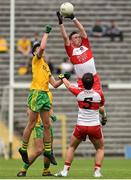 27 June 2015; Patrick Kearney, Derry, in action against Michael Langan, Donegal.  Electric Ireland Ulster GAA Football Minor Championship, Semi Final, Derry v Donegal. St Tiernach's Park, Clones, Co. Monaghan. Picture credit: Ramsey Cardy / SPORTSFILE
