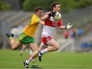 27 June 2015; Brian Cassidy, Derry, in action against Mark Coyle, Donegal.  Electric Ireland Ulster GAA Football Minor Championship, Semi Final, Derry v Donegal. St Tiernach's Park, Clones, Co. Monaghan. Picture credit: Ramsey Cardy / SPORTSFILE