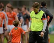 27 June 2015; Armagh manager Kieran McGeeney with his son Cian, age 7, after the game. GAA Football All-Ireland Senior Championship, Round 1B, Armagh v Wicklow. Athletic Grounds, Armagh. Picture credit: Piaras Ó Mídheach / SPORTSFILE