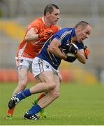 27 June 2015; Patrick McWalter, Wicklow, in action against Andy Mallon, Armagh. GAA Football All-Ireland Senior Championship, Round 1B, Armagh v Wicklow. Athletic Grounds, Armagh. Picture credit: Piaras Ó Mídheach / SPORTSFILE