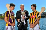 30 June 2015; Kilkenny’s Conor Martin and Wexford’s Conor McDonald were at Grand Canal Dock in Dublin today ahead of the Bord Gáis Energy GAA Hurling U-21 Leinster Championship Final at Wexford Park on Wednesday, July 8th at 7.30pm. The match will be shown live on TG4 with fans able to vote for their man of the match using the #laochBGE hashtag on Twitter. Pictured is Bord Gáis Energy sports ambassador Ger Cunningham, centre, with Wexford’s Conor McDonald, left, and  Kilkenny’s Conor Martin. Grand Canal Dock, Dublin. Picture credit: Ramsey Cardy / SPORTSFILE