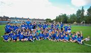 30 June 2015; Leinster Rugby's Kevin McLaughlin and Aaron Dundon headed out to the Bank of Ireland Leinster Rugby Summer Camps in Donnybrook Stadium to meet up with some local young rugby talent. Pictured are Kevin McLaughlin and Aaron Dundon with all of the participants during the Bank of Ireland Leinster Rugby Summer Camps 2015. Donnybrook Stadium, Donnybrook, Dublin. Picture credit: Dáire Brennan / SPORTSFILE