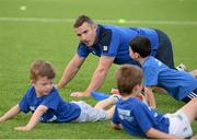 30 June 2015; Leinster Rugby's Kevin McLaughlin and Aaron Dundon headed out to the Bank of Ireland Leinster Rugby Summer Camps in Donnybrook Stadium to meet up with some local young rugby talent. Pictured are Leinster's Aaron Dundon and participants in action during Bank of Ireland the Leinster Rugby Summer Camps 2015. Donnybrook Stadium, Donnybrook, Dublin. Picture credit: Dáire Brennan / SPORTSFILE