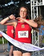 30 June 2015; Carol Finn, UCC Athletics, crosses the line to win the Grant Thornton Corporate 5k Team Challenge. Cork. Picture credit: Cody Glenn / SPORTSFILE