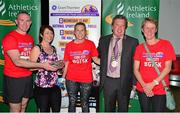 30 June 2015; John Kelly, left, former Munster rugby player and current Grant Thornton Director and Bill Allen, second from right, Chairman of Cork Athletics, presents members of the Mercy Hospital Nurses with their cup for finishing fifth in the female team category in the Grant Thornton Corporate 5k Team Challenge. Cork. Picture credit: Cody Glenn / SPORTSFILE