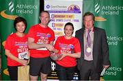 30 June 2015; John Kelly, second from left, former Munster rugby player and current Grant Thornton Director, and Bill Allen, right, Chairman of Cork Athletics, presents Grace Tan, left, and Lisa Leonard of the O'Connor Pyne & Co. Ltd. with their cup for finishing fourth in the female team category in the Grant Thornton Corporate 5k Team Challenge. Cork. Picture credit: Cody Glenn / SPORTSFILE