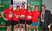 30 June 2015; John Kelly, left, former Munster rugby player and current Grant Thornton Director, and Bill Allen, right, Chairman of Cork Athletics, presents members of the Run the Numbers team with their cup for finishing second in the female team category in the Grant Thornton Corporate 5k Team Challenge. Cork. Picture credit: Cody Glenn / SPORTSFILE