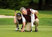 18 September 2008; Naas Golf Club's Conor O'Rourke and his dad and caddy John line up a putt on the 14th green during the Bulmers Junior Cup Final. Bulmers Cups and Shields Finals 2008, Monkstown Golf Club, Parkgarriff, Monkstown, Co. Cork. Picture credit: Ray McManus / SPORTSFILE