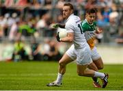 4 July 2015; Alan Smith, Kildare, in action against Joey O'Connor, Offaly. GAA Football All-Ireland Senior Championship, Round 2A, Offaly v Kildare. O'Connor Park, Tullamore, Co. Offaly. Picture credit: Piaras Ó Mídheach / SPORTSFILE