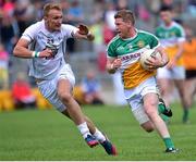 4 July 2015; Brian Darby of Offaly in action against Tommy Moolick of Kildare during the GAA Football All-Ireland Senior Championship Round 2A match between Offaly and Kildare at O'Connor Park in Tullamore, Co. Offaly. Photo by Cody Glenn/Sportsfile