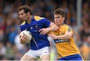 4 July 2015; Barry Gilleran, Longford, in action against Martin McMahon, Clare. GAA Football All-Ireland Senior Championship, Round 2A, Clare v Longford. Cusack Park, Ennis, Co. Clare. Picture credit: Stephen McCarthy / SPORTSFILE