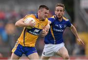 4 July 2015; Ciaran Russell, Clare, in action against Colman P. Smyth, Longford. GAA Football All-Ireland Senior Championship, Round 2A, Clare v Longford. Cusack Park, Ennis, Co. Clare. Picture credit: Stephen McCarthy / SPORTSFILE