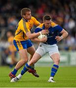 4 July 2015; Michael Quinn, Longford, in action against Sean Collins, Clare. GAA Football All-Ireland Senior Championship, Round 2A, Clare v Longford. Cusack Park, Ennis, Co. Clare. Picture credit: Stephen McCarthy / SPORTSFILE
