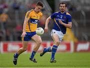 4 July 2015; Jamie Malone, Clare, in action against Barry Gilleran, Longford. GAA Football All-Ireland Senior Championship, Round 2A, Clare v Longford. Cusack Park, Ennis, Co. Clare. Picture credit: Stephen McCarthy / SPORTSFILE
